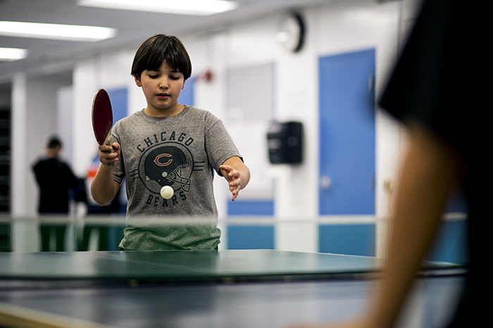 Boy playing ping pong